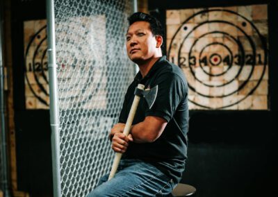 A Man in Black Shirt Holding an Axe new